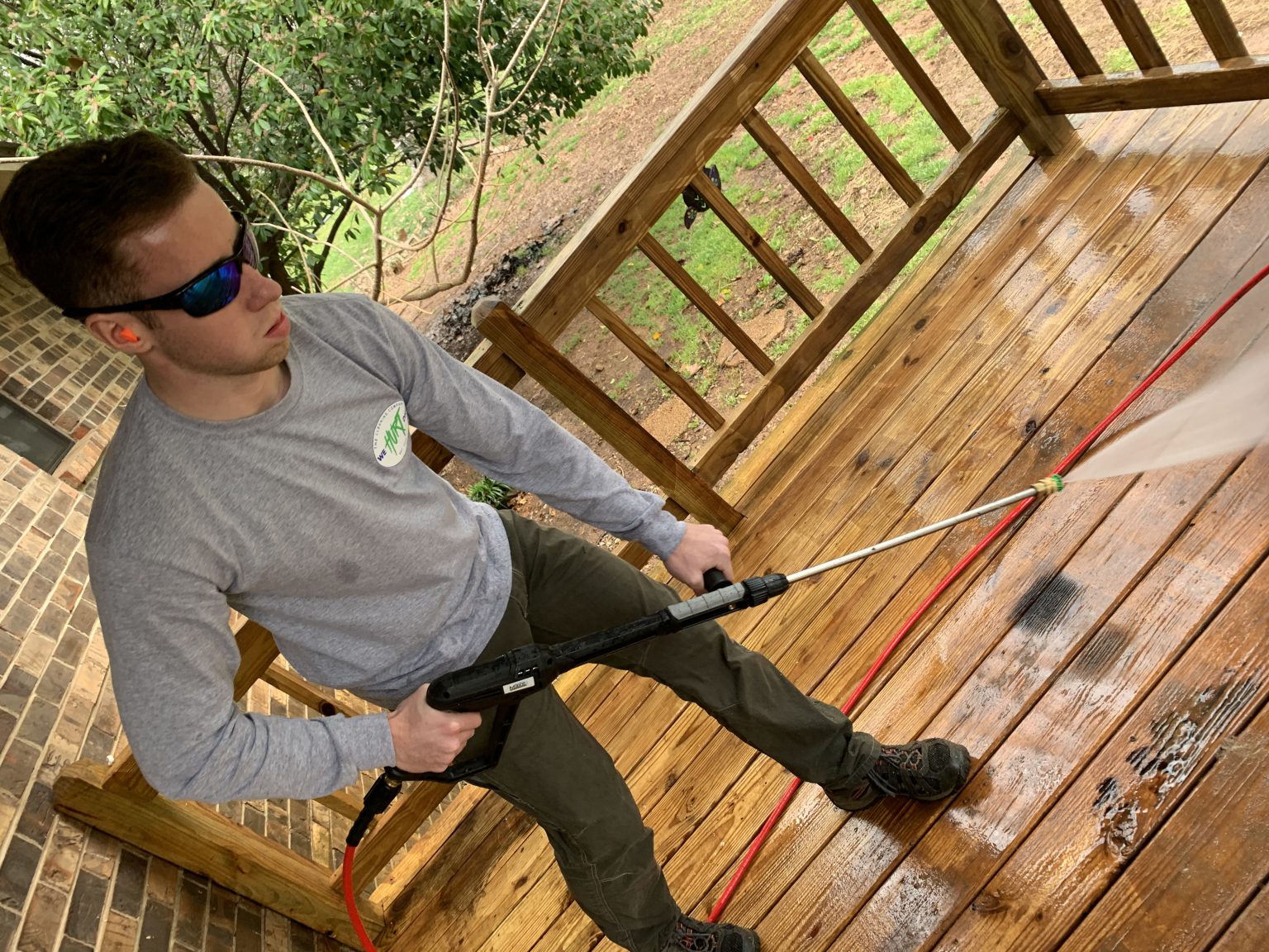Andrew Snider on a pressure washing job site