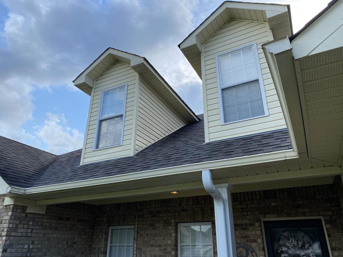 House exterior siding being cleaned