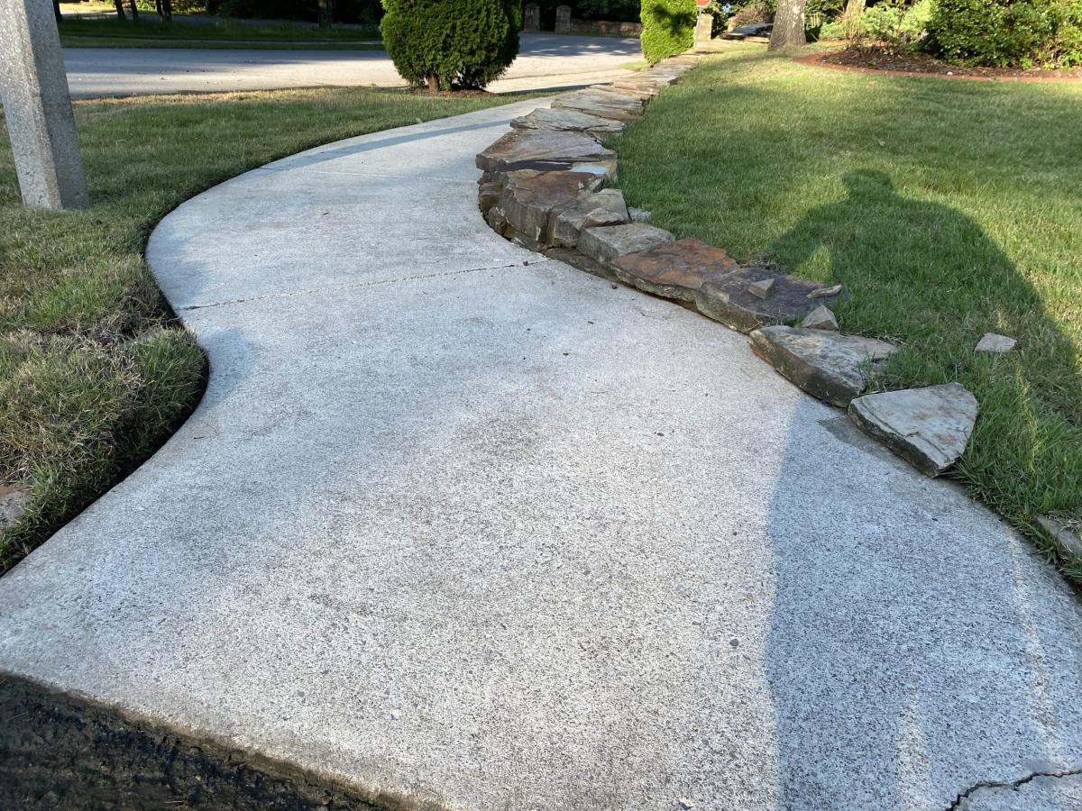 Clean sidewalk after pressure washing