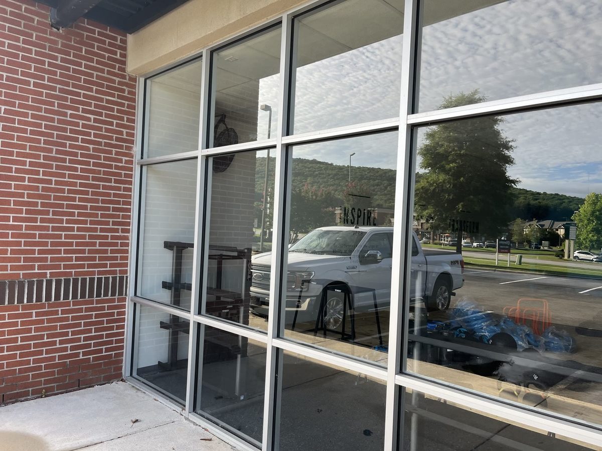 Clean storefront windows after window cleaning